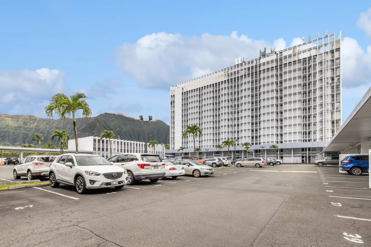The Haiku Hale tower and resident parking, framed by the mountains