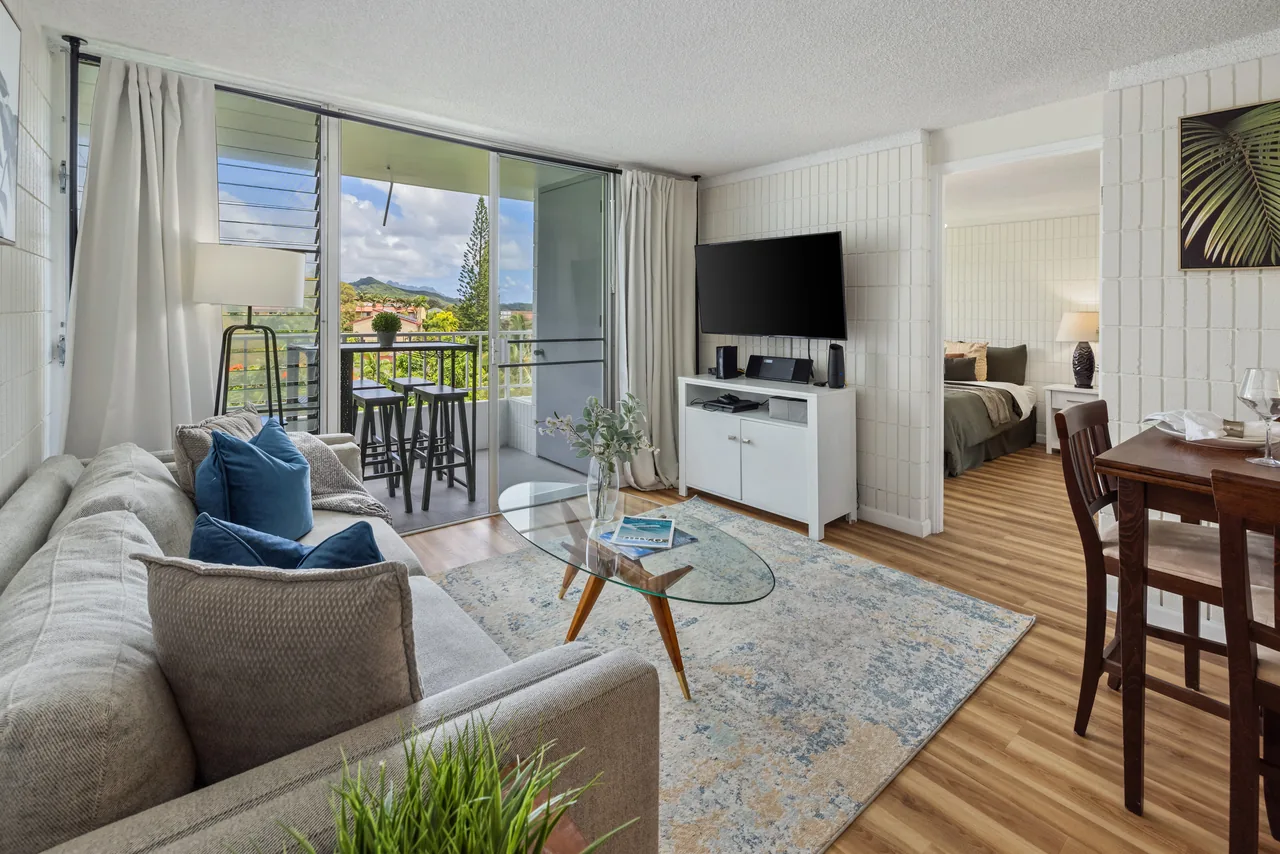 Sunlit living and dining space flowing out to a private covered lanai